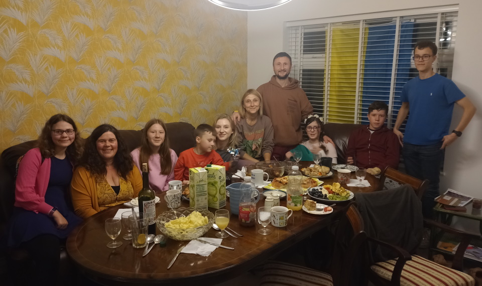 My family and a Ukrainian family enjoying a meal